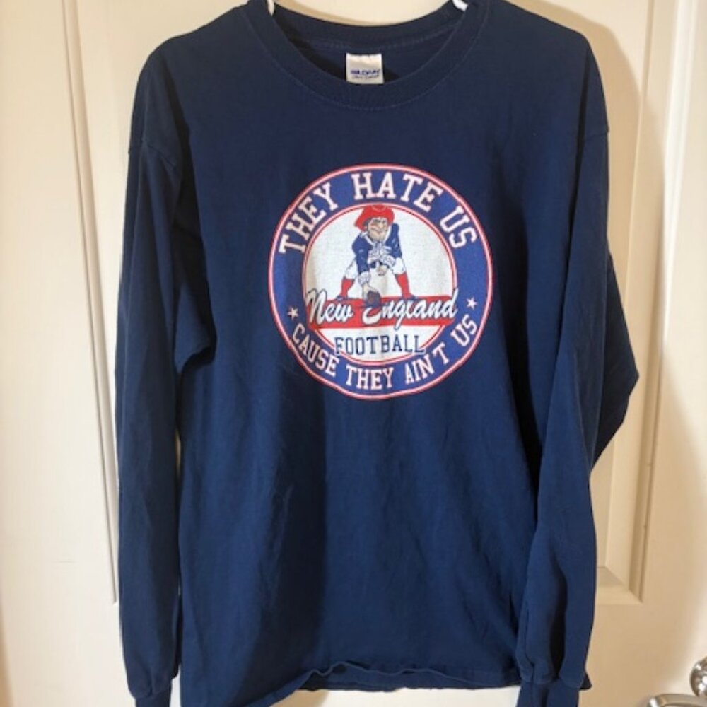 New England Patriots Long Sleeve Graphic Tee – “They Hate Us Cause They Ain’t Us